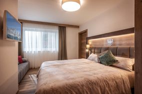 APART deluxe bedroom with comfortable box spring beds