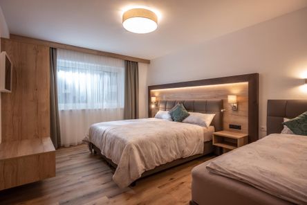 Schlafzimmer für 3 Gäste im APART deluxe Söll in Tirol