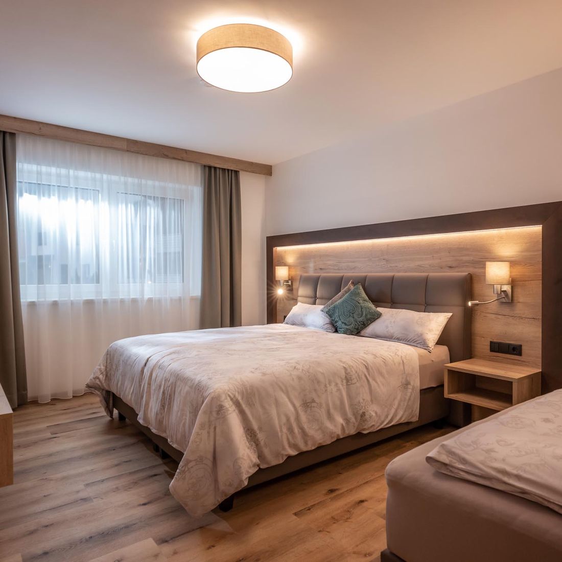 Schlafzimmer für 3 Gäste im APART deluxe am Wilden Kaiser
