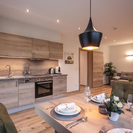 the kitchen is fully equipped, including dishwasher and coffee machine