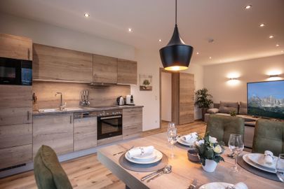 the kitchen is fully equipped, including dishwasher and coffee machine